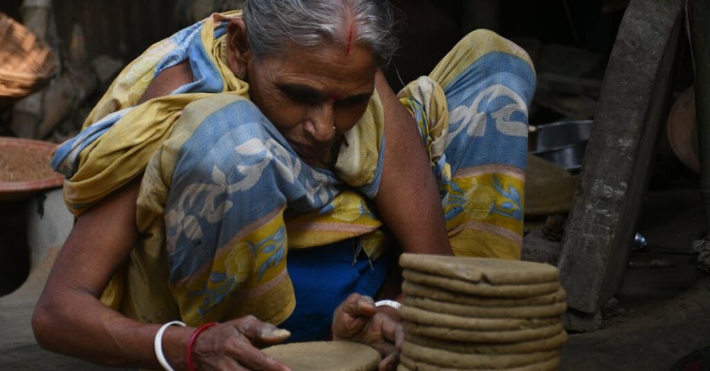 岡山県の地元外壁塗装業者が住宅外壁を塗装している様子。地域密着型の信頼と職人の丁寧な作業を表現した写真。